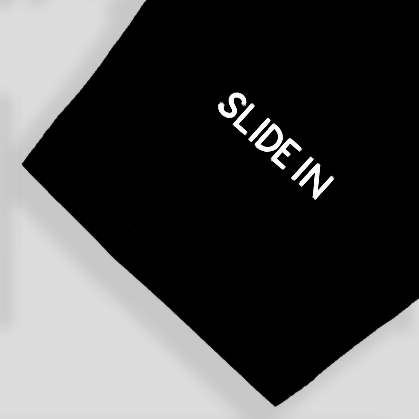 oversized black t-shirt with brand name printed on sleeve